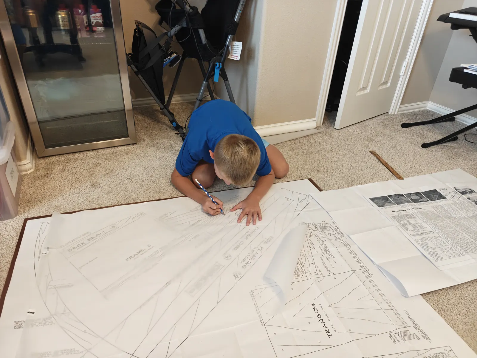 Full-size Glen-L patterns being traced onto plywood for a Tiny Titan hydroplane