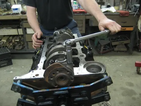 Hot Rod: 355 engine: To check the main bearing oil clearance, we cut a plastigauge strip and placed it on the c
