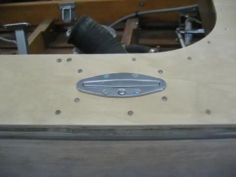 Hot Rod: Deck: Blocking for the aft stainless steel pop-up deck cleats wax glued up