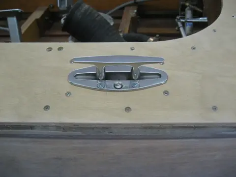 Hot Rod: Deck: Blocking for the aft stainless steel pop-up deck cleats wax glued up