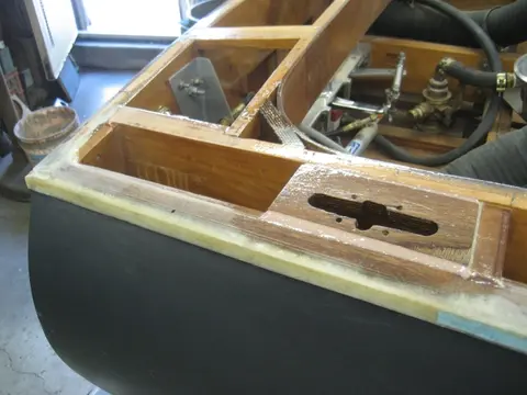 Hot Rod: Deck: Blocking for the aft stainless steel pop-up deck cleats wax glued up