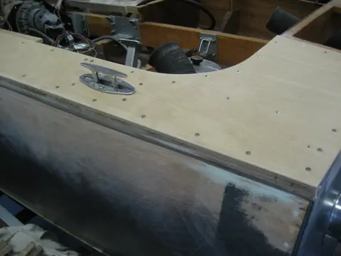 Hot Rod: Deck: Blocking for the aft stainless steel pop-up deck cleats wax glued up