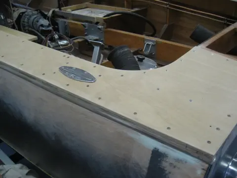 Hot Rod: Deck: Blocking for the aft stainless steel pop-up deck cleats wax glued up