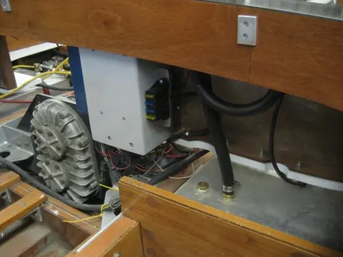 Hot Rod: Jump seats and fuel tank: The 5/8" rubber fuel vent hose has been looped to form a high loop before its routed to th