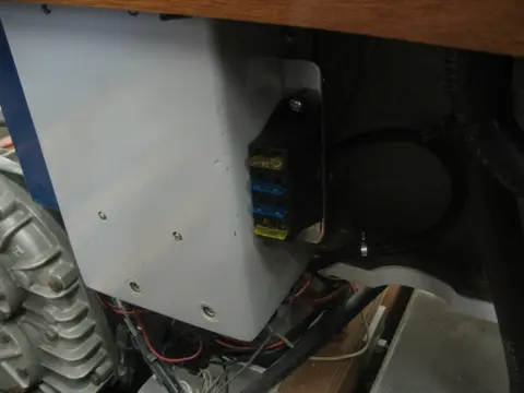 Hot Rod: Jump seats and fuel tank: The 5/8" rubber fuel vent hose has been looped to form a high loop before its routed to th