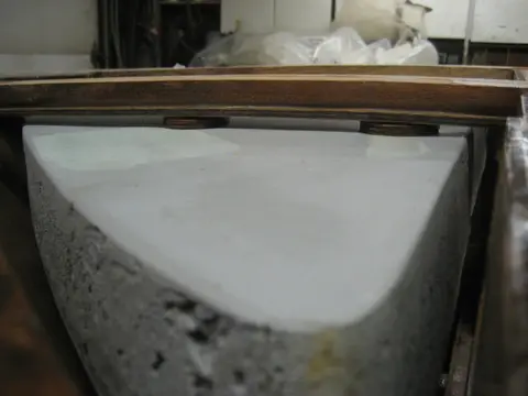Hot Rod: Deck: Before epoxying the deck, we had to trim the flotation foam billets to clear our new bow l