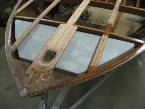 Hot Rod: Deck: Before epoxying the deck, we had to trim the flotation foam billets to clear our new bow l