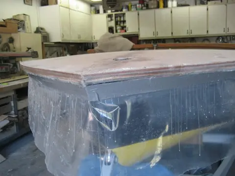 Hot Rod: Deck: With the deck plywood installed, it's time to build up two layers of ten ounce fiberglass