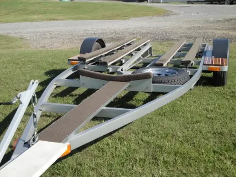 Hot Rod: Trailer: We welded a square tube stub into the fender step to receive a removable boat guide on the