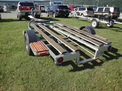 Hot Rod: Trailer: We welded a square tube stub into the fender step to receive a removable boat guide on the