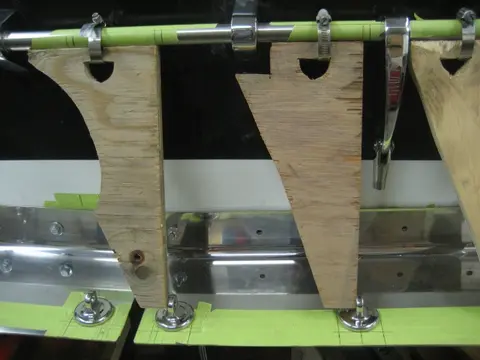 Hot Rod: Cavitation plates: We fabricated an alignment jig made from 3/4" plywood scraps and hose clamps to mark locat