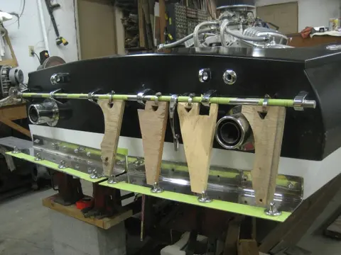 Hot Rod: Cavitation plates: We fabricated an alignment jig made from 3/4" plywood scraps and hose clamps to mark locat