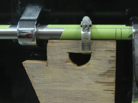 Hot Rod: Cavitation plates: We fabricated an alignment jig made from 3/4" plywood scraps and hose clamps to mark locat