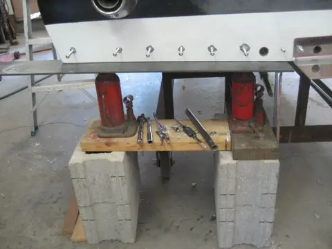 Hot Rod: Cavitation plates: A 9/32" pilot hole was bored followed by a 5/16" tap to thread the bolt hole