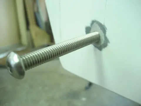 Hot Rod: Cavitation plates: A 9/32" pilot hole was bored followed by a 5/16" tap to thread the bolt hole