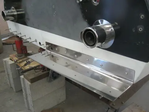 Hot Rod: Cavitation plates: A 9/32" pilot hole was bored followed by a 5/16" tap to thread the bolt hole