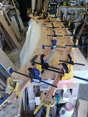 Jersey Girl: Amping up production here, with two roof beams glued up at the same time.