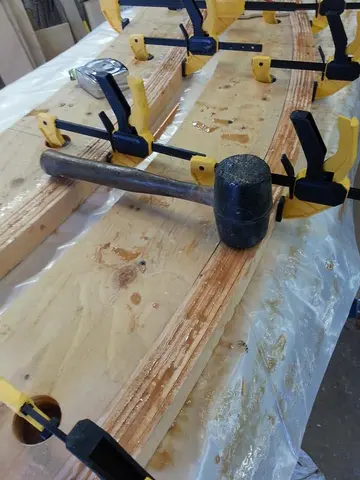 Jersey Girl: Amping up production here, with two roof beams glued up at the same time.