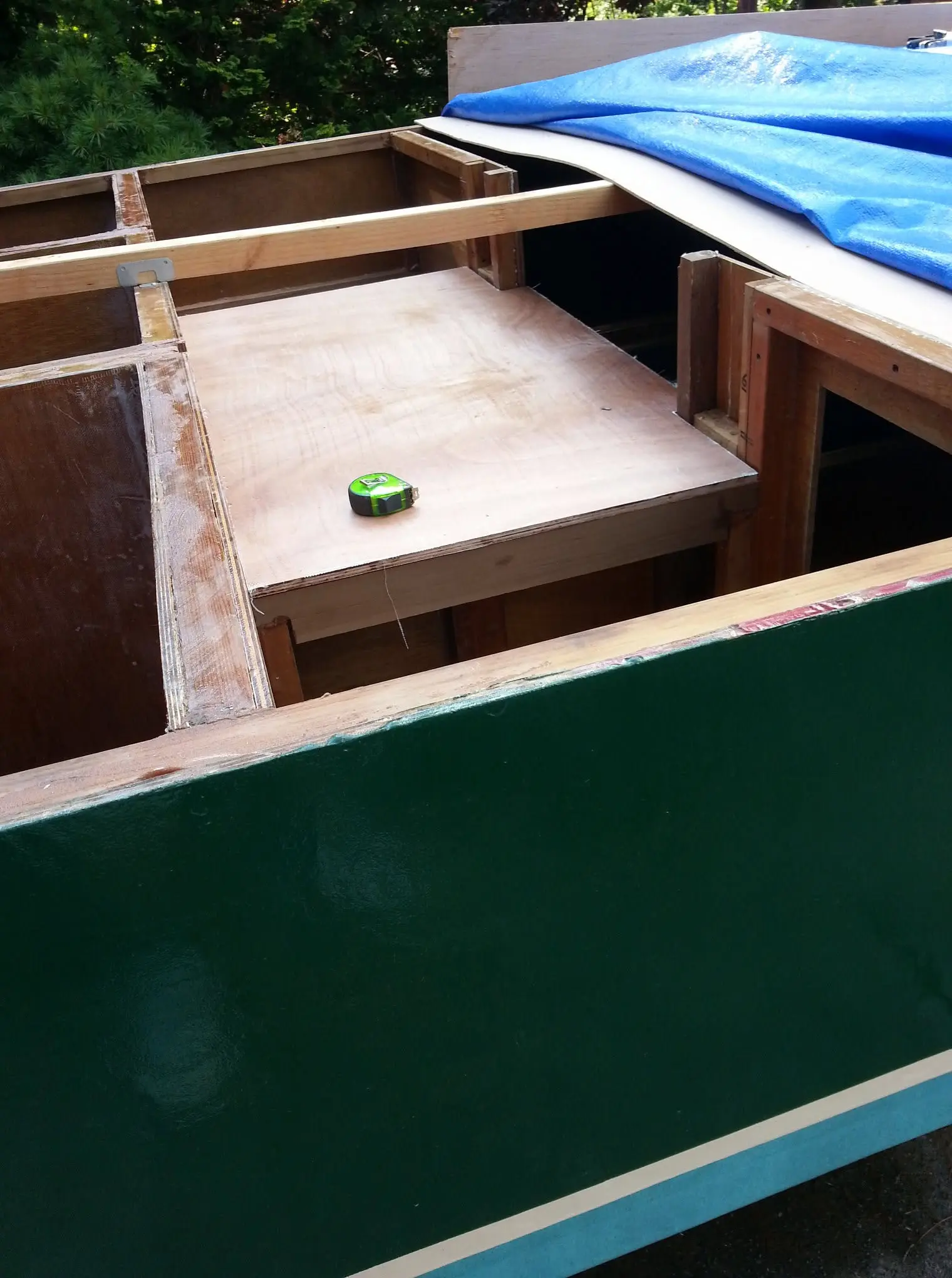 Jersey Girl: Jersey Girl's aft deck, sealed in fiberglass fabric and epoxy on both sides, is dry...